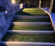 Landscape lighting on grass stairs outside