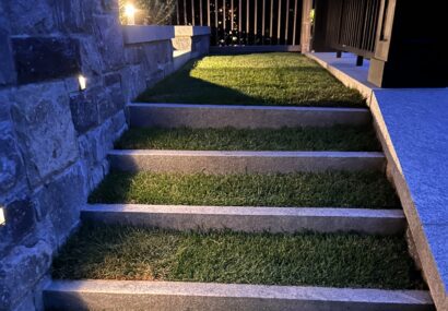 Landscape lighting on grass stairs outside