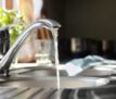 Water running from tap into kitchen sink